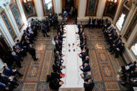 U.S. Trade Representative Robert Lighthizer (7thR), Treasury Secretary Steven Mnuchin, Commerce Secretary Wilbur Ross, White House economic adviser Larry Kudlow and White House trade adviser Peter Navarro pose for a photograph with China's Vice Premier Liu He (7thL), Chinese vice ministers and senior officials before the start of US-China trade talks at the White House in Washington, U.S., February 21, 2019. REUTERS/Joshua Roberts