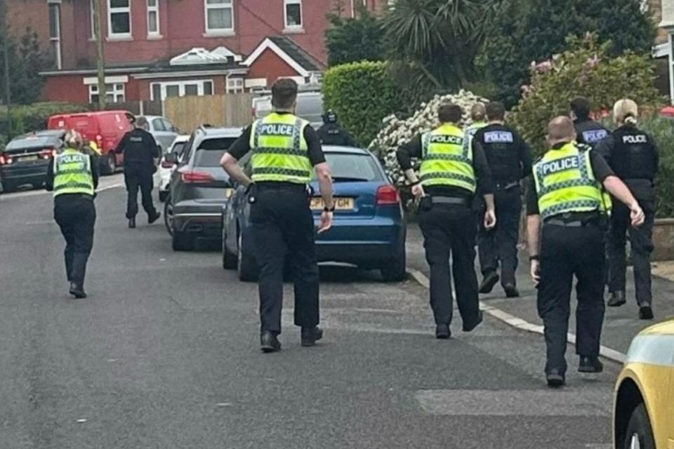 Bournemouth Echo: Bournemouth police smashing through Richmond Park Crescent home