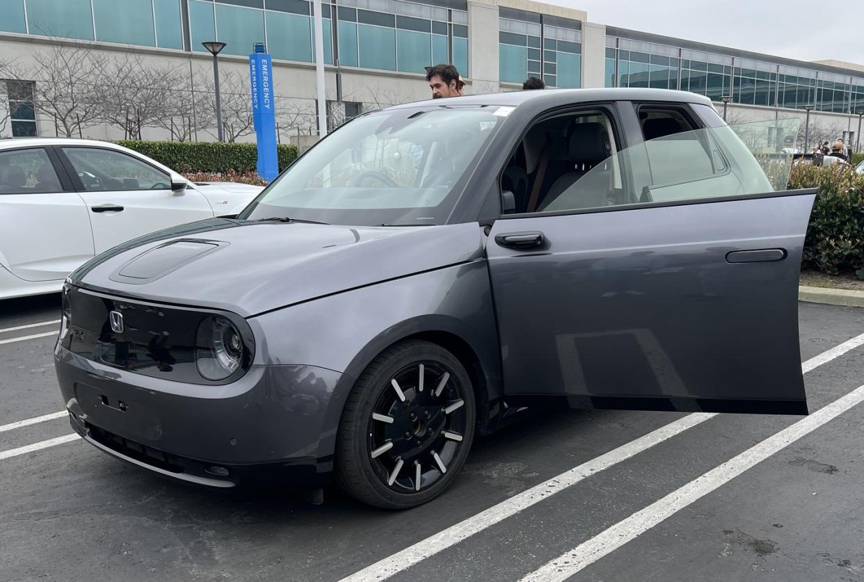 a person standing in a car