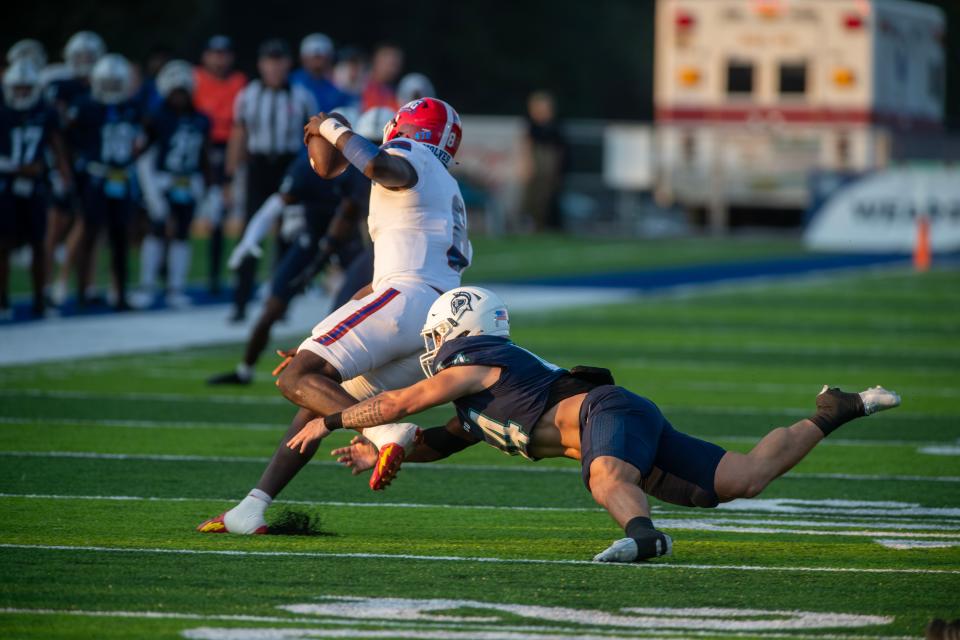 West Florida's Walker Robinson goes after West Georgia Quarterback Cameran Brown during the Gulf South Conference opener against West Georgia at Pen Air Field at the University of West Florida Saturday, September 23, 2023.