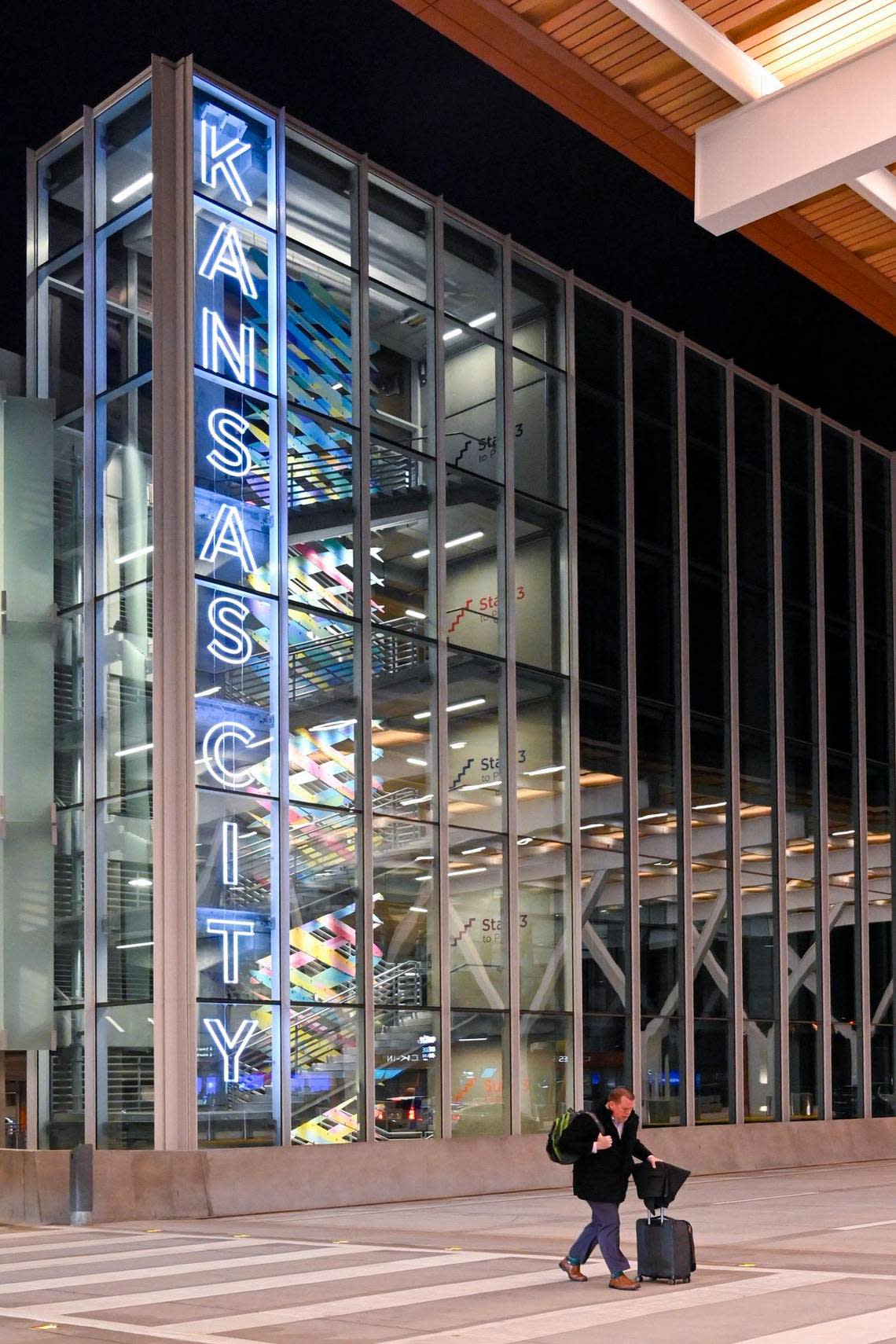 A traveler walks into the new $1.5 billion single terminal from the parking garage at Kansas City International Airport, which opened to travelers Tuesday, Feb. 28, 2023.