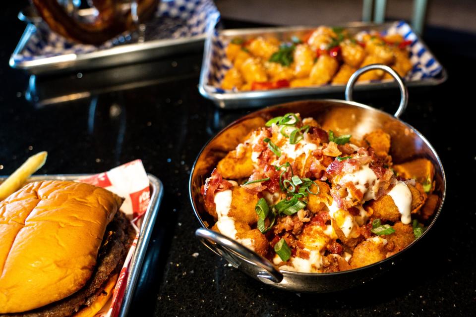 Dishes found in the Red Room at Vibrant Music Hall include loaded cheese curds.