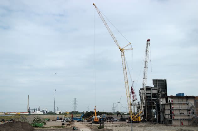 Cranes work to disassemble what remains of the coal-fired power plant that, until recently, operated alongside the Borssele nuclear plant. (Photo: Alexander C. Kaufman/HuffPost)