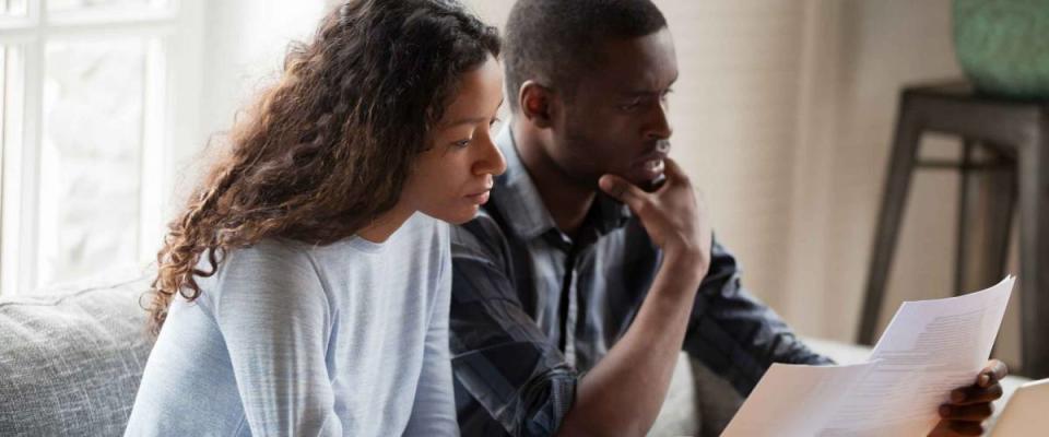 Couple reviewing refinance documents