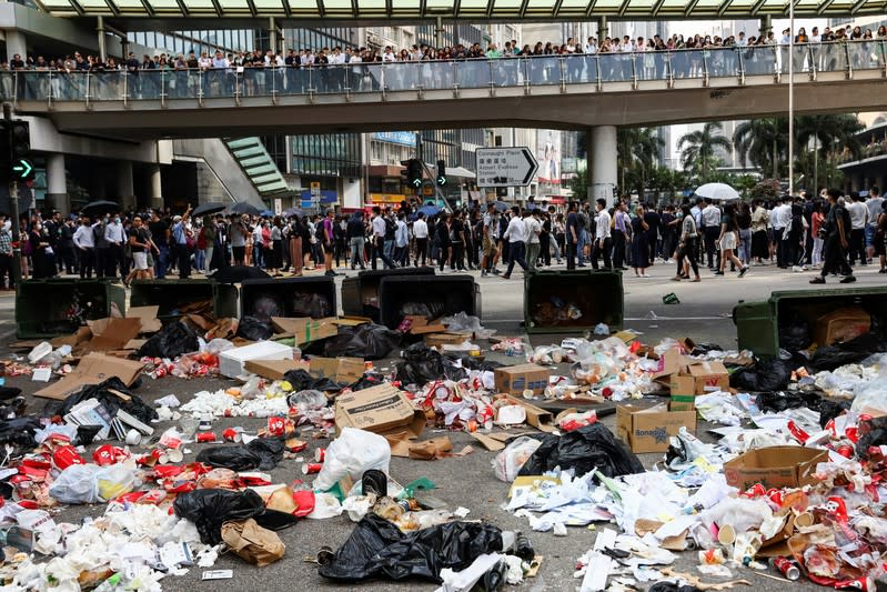 Garbage are seen laid across a road by anti-government demonstrators as a barricade against the police during a protest in Central, Hong Kong