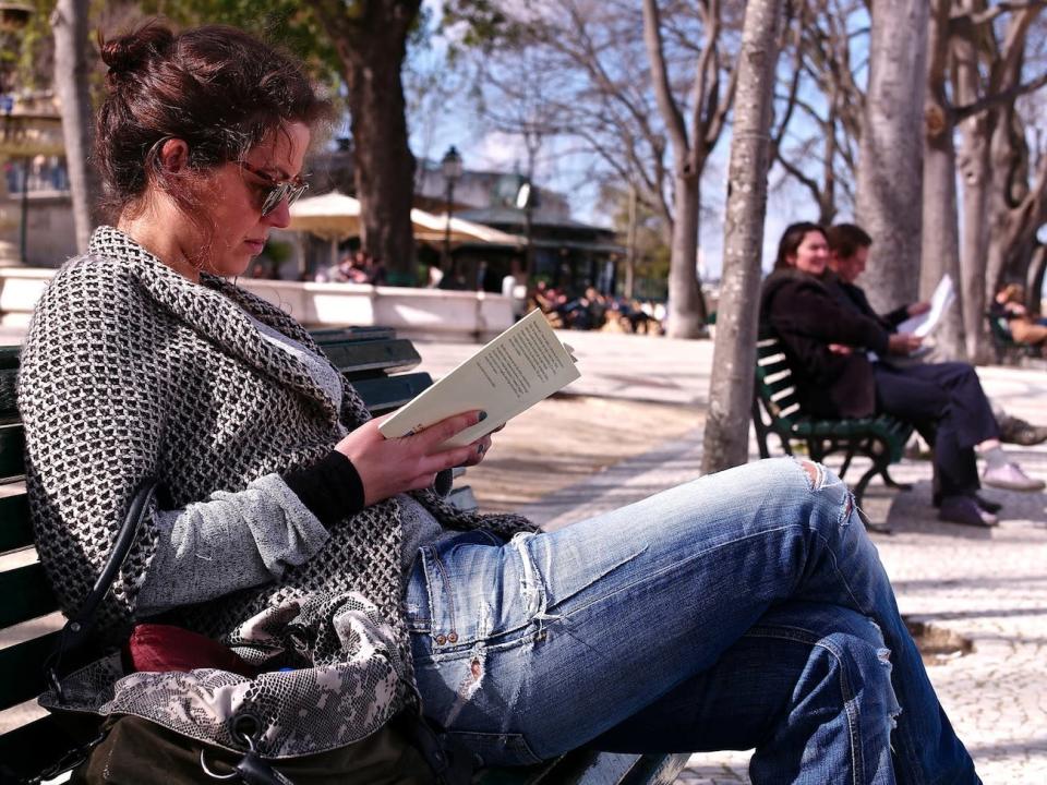 woman reading outside