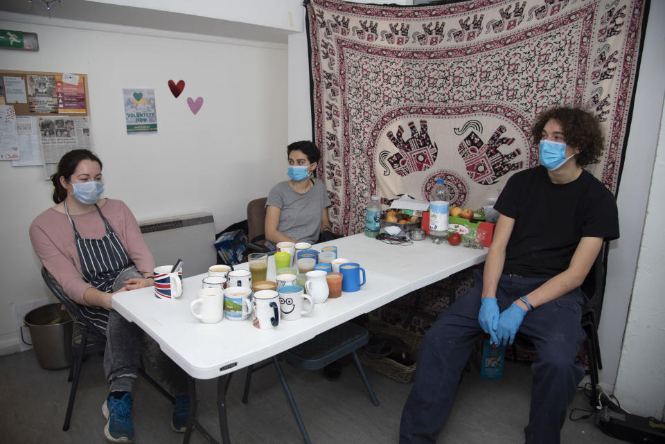 Volunteers take a break whilst preparing free hot meals for distibution during the coronavirus crisis in London, UK on April 22, 2020. 'Food For All' are a London based charity offering a free hot meal service to people in need in inner London throughout the Covid-19 pandemic. Food is donated by New Covent Garden Market and wholesalers. They deliver meals to local distribution hubs, food banks and mutual aid groups. Today 3,000 meals are being prepared with capacity to deliver 20,000 per day. (Photo by Claire Doherty/Sipa USA)