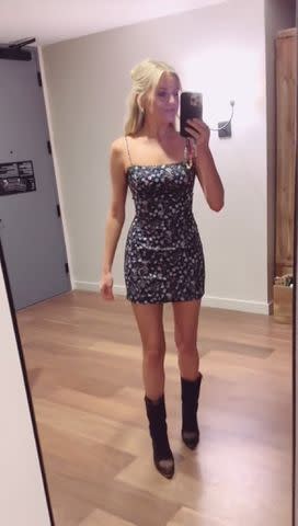 <p>kelsea ballerini/Tiktok</p> Kelsea Ballerini poses in the mirror as she shows off her outfit in the TikTok video.