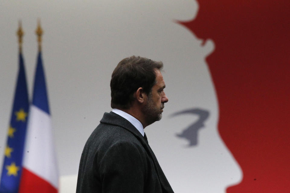 French Interior Minister Christophe Castaner walks in the courtyard of the Paris police headquarters during a ceremony for the four victims of last week's knife attack, Tuesday, Oct. 8, 2019 in Paris. France's presidency says the four victims of last week's knife attack at the Paris police headquarters will be posthumously given France's highest award, the Legion of Honor. (AP Photo/Francois Mori)