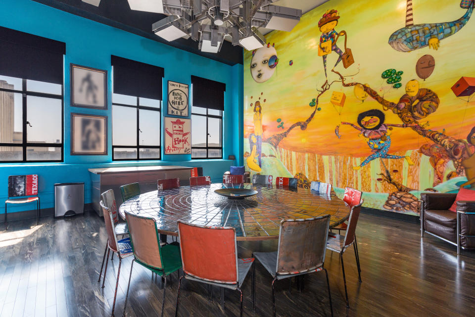 <p><span>This dining room boasts wood floors, a beautiful mural and plenty of natural light. </span></p>