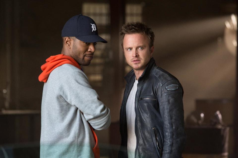 This image released by DreamWorks II shows Scott Mescudi, left, and Aaron Paul in a scene from “Need for Speed.” (AP Photo/DreamWorks II, Melinda Sue Gordon)