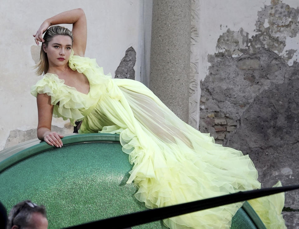 <p>Dressed in a lime green semi-sheer gown, <a href="https://people.com/tag/florence-pugh/" rel="nofollow noopener" target="_blank" data-ylk="slk:Florence Pugh;elm:context_link;itc:0;sec:content-canvas" class="link ">Florence Pugh</a> strikes a pose while shooting a commercial for Valentino in Rome on March 26.</p>