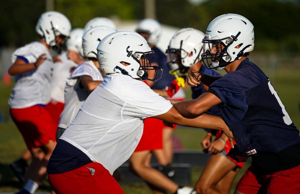 Football players take part in practice at Estero High School on Tuesday, Aug. 1, 2023. (Syndication: Naples Daily News)