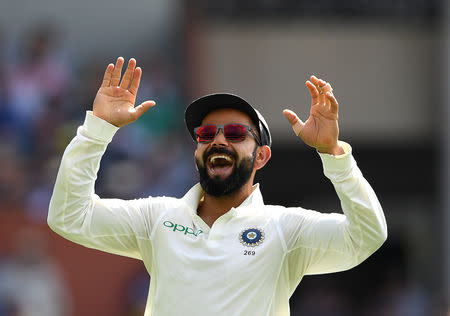 India's captain Virat Kohli reacts after Australia's Usman Khawaja was dismissed for 8 runs on day four of the first match between Australia and India at the Adelaide Oval in Adelaide, Australia, December 9, 2018. AAP/Dave Hunt/via REUTERS