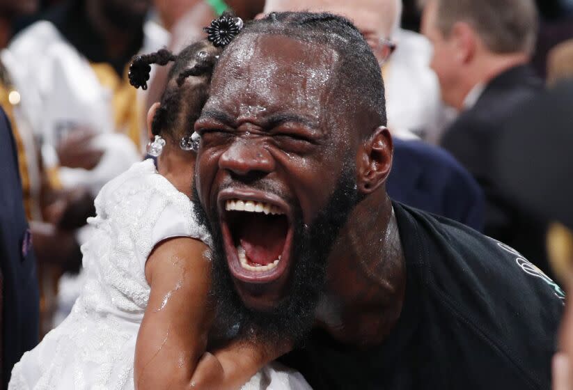 Deontay Wilder celebrates after defeating Luis Ortiz in the WBC heavyweight title boxing match Saturday, Nov. 23, 2019, in Las Vegas. (AP Photo/John Locher)