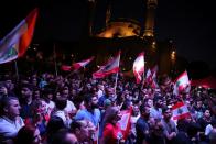 Demonstrators take part in an anti-government protest in downtown Beirut