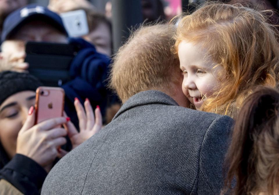 Also during the couple's visit to Hamilton Square, Prince Harry <a rel="nofollow noopener" href="https://people.com/royals/prince-harry-hugs-redhead-girl-gingers-unite-sign/" target="_blank" data-ylk="slk:befriended a 4-year-old redhead;elm:context_link;itc:0;sec:content-canvas" class="link ">befriended a 4-year-old redhead</a> named Eliza, who was carrying a sign that read "#GingersUnite." Before giving her a big hug, Harry told her, “I love this! Do you love your hair?”