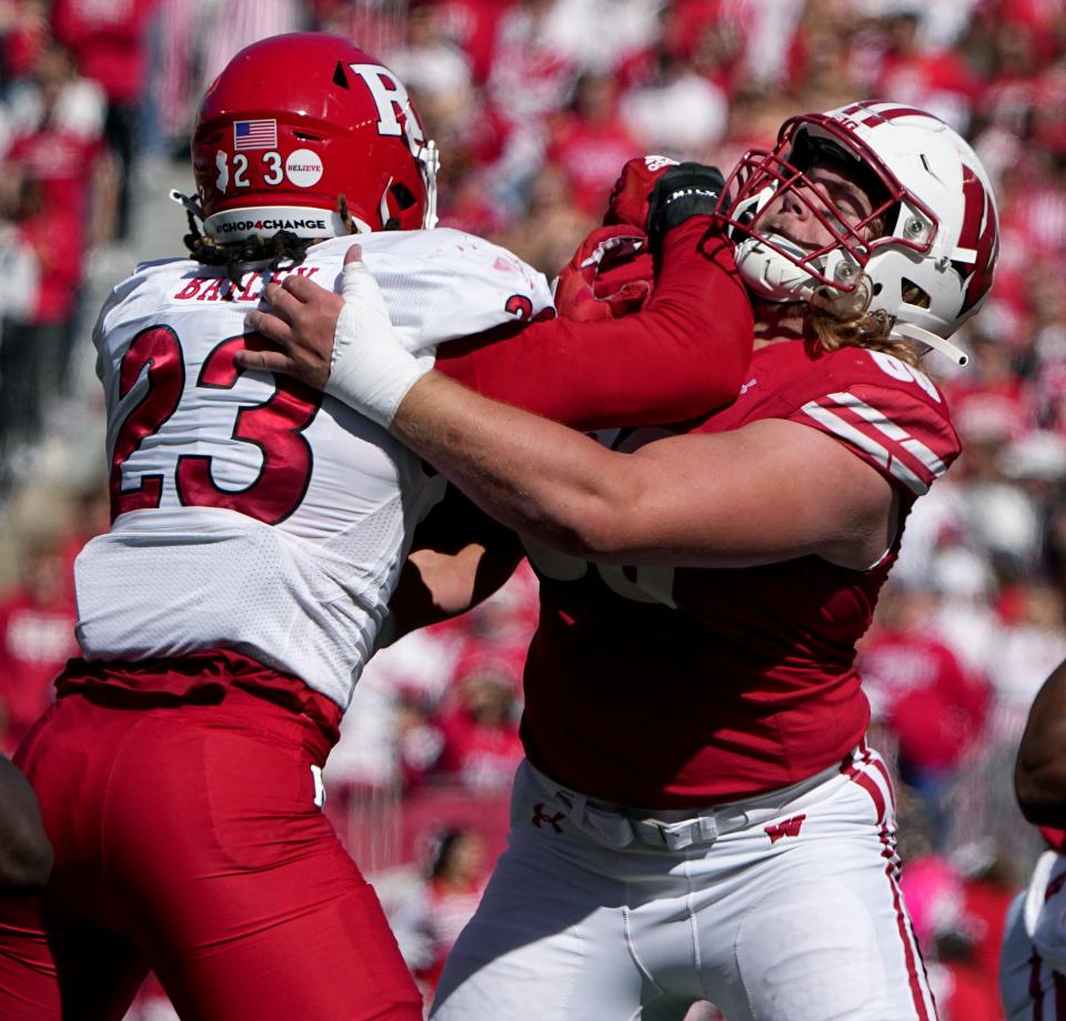 Wisconsin's Joe Huber, right, has the versatility to play anywhere along the offensive line.