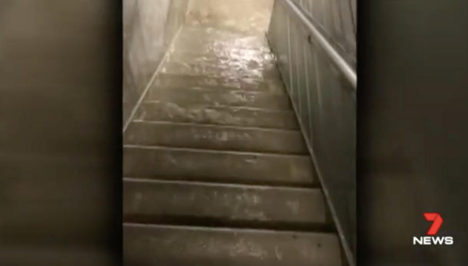 Water pours down the stairs of the Southbank complex. Source: 7 News
