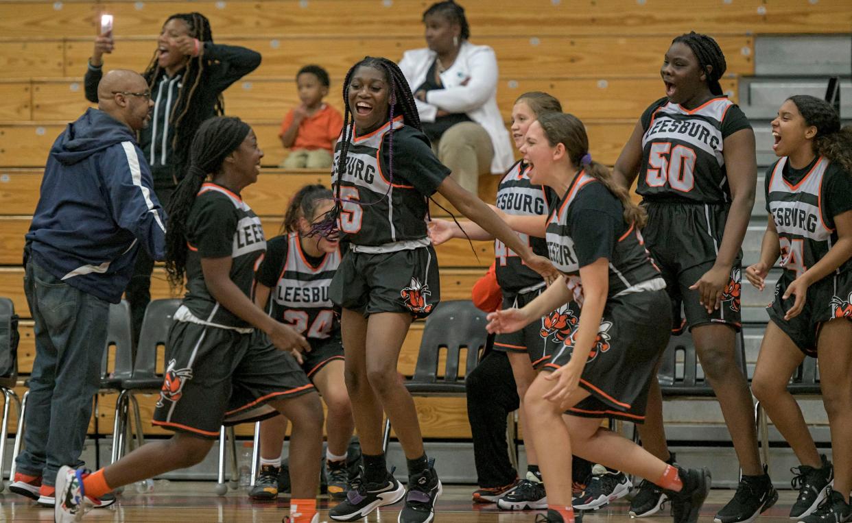 The Leesburg High School girls basketball team celebrates if first win of the season Thursday against South Sumter in Bushnell. [PAUL RYAN / CORRESPONDENT]