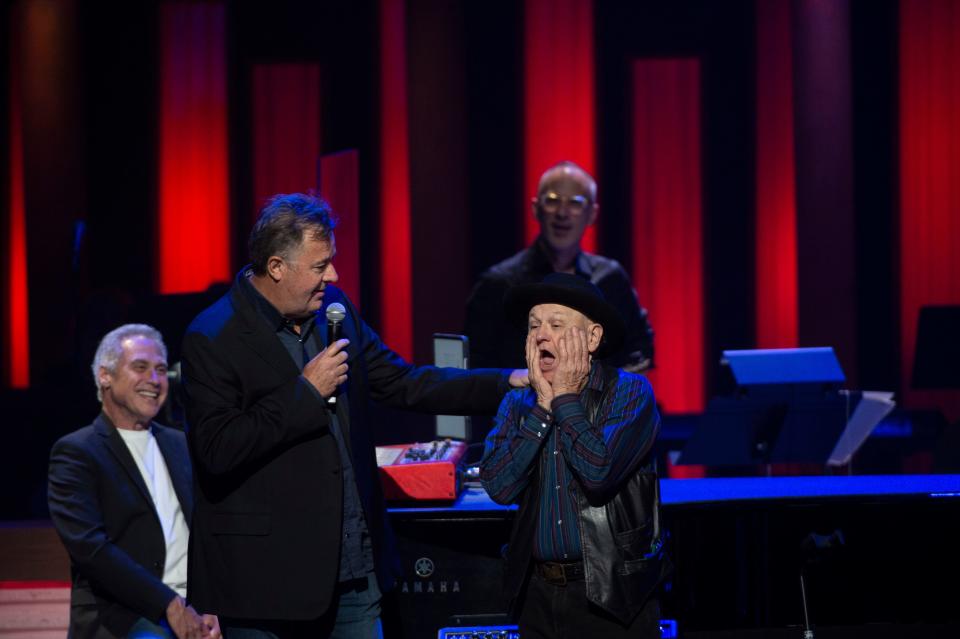 Charlie McCoy reacts after being invited to become a member of the Grand Ole Opry at Grand Ole Opry  in Nashville , Tenn., Saturday, June 11, 2022.