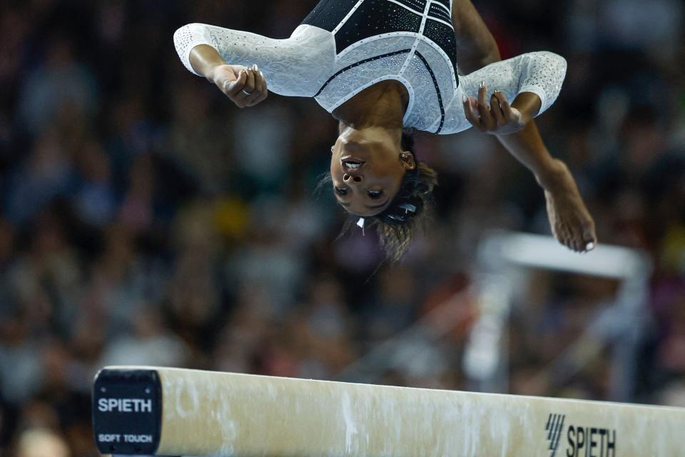 TOPSHOT - USA's Simone Biles, performs on the balance beam, during the 39th edition of the US Classic gymnastics competition at Now Arena in Hoffman Estates, suburb of Chicago, Illinois, on August 5, 2023. Four-time Olympic champion gymnast Simone Biles returned to competition for the first time since the Tokyo Olympics today at the US Classic, ending a two-year hiatus.

The 19-time world champion began the event on the uneven bars, where her strong performance received a score of 14.000 points from judges before a cheering sellout crowd in suburban Chicago. (Photo by KAMIL KRZACZYNSKI / AFP) (Photo by KAMIL KRZACZYNSKI/AFP via Getty Images) ORIG FILE ID: AFP_33QP6CR.jpg