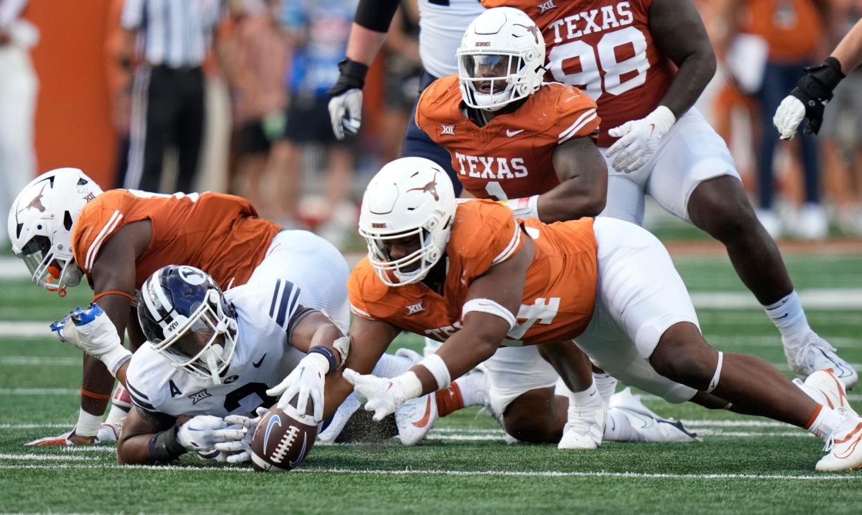 Texas defensive lineman Jaray Bledsoe recovers a BYU fumble in the fourth quarter of last Saturday's 35-6 win at Royal-Memorial Stadium. This week's matchup with No. 25 Kansas State features two of the Big 12's top defenses.