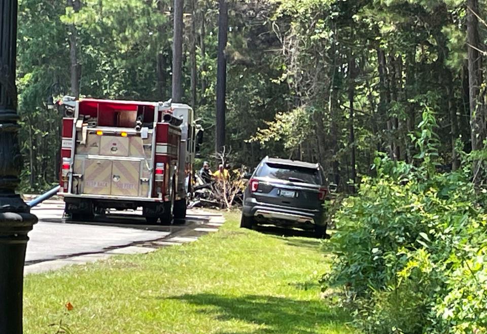 Emergency personnel respond to a single-engine plane crash in the area of Barefoot Landing, in North Myrtle Beach, S.C., Sunday, July 2, 2023.