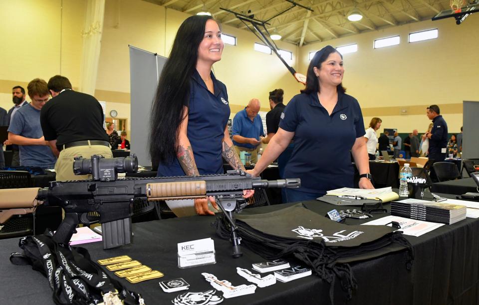 Bethany Beck, a human resources administrator at Titusville-based Knight Enterprises Management, and Elizabeth Cox, a recruiter for the weapons company, were seeking to fill 25 positions at Knight during a Nov. 30 job fair in Viera.