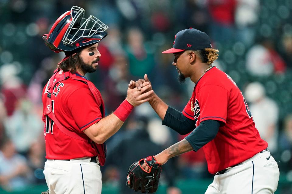 Cleveland relief pitcher Emmanuel Clase, right, celebrates with catcher Austin Hedges after the Indians defeated the Minnesota Twins 4-1 in a baseball game, Thursday, Sept. 9, 2021, in Cleveland. (AP Photo/Tony Dejak)