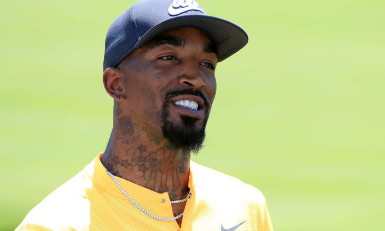 Former NBA shooting guard J.R Smith playing golf.