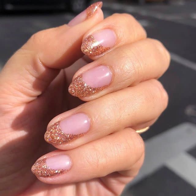 <p>A rose gold glitter on top of a pink gel polish makes for the perfect #Nailfie.</p><p><a href="https://www.instagram.com/p/BzEtv-tAt1y/" rel="nofollow noopener" target="_blank" data-ylk="slk:See the original post on Instagram;elm:context_link;itc:0;sec:content-canvas" class="link ">See the original post on Instagram</a></p>