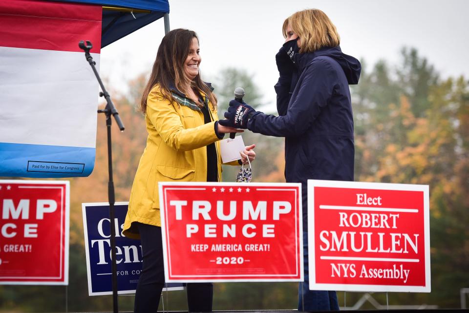 From left, Congresswoman Elise Stefanik hands a microphone to U.S. Rep candidate Claudia Tenney during a Back the Blue rally at the Dolgeville Athletic Club on Tuesday, Oct. 13, 2020. In addition to Stafanik and Tenney, New York State Assemblyman Robert Smullen and Herkimer County family court judge candidate Thad Luke also spoke to supporters.