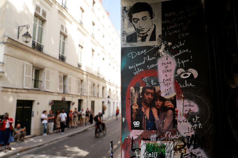 People walk near the house turned museum where late actor and singer Jane Birkin has lived, in Paris