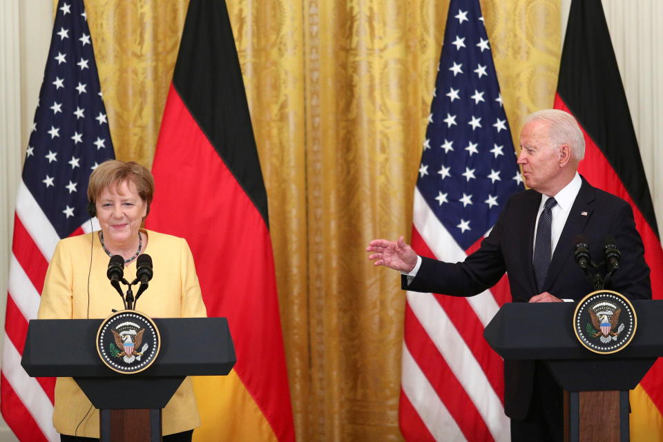 U.S. President Joe Biden and German Chancellor Angela Merkel attend a joint news conference in the East Room at the White House in Washington, U.S., July 15, 2021. REUTERS/Tom Brenner     TPX IMAGES OF THE DAY