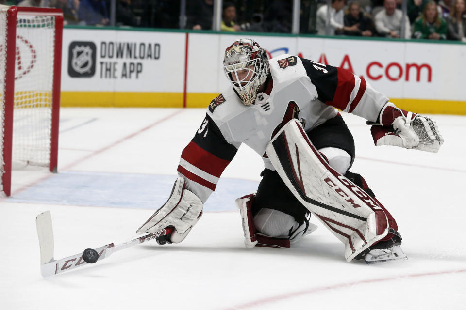 Arizona Coyotes goaltender Adin Hill stops a shot by the Dallas Stars during the first period of an NHL hockey game in Dallas, Wednesday, Feb. 19, 2019. (AP Photo/Michael Ainsworth)