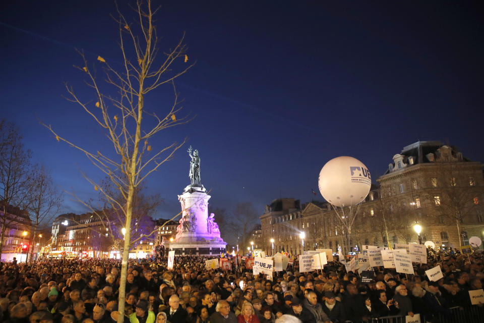 People gather at the Republique square to protest against anti-Semitism, in Paris, France, Tuesday, Feb. 19, 2019. In Paris and dozens of other French cities, ordinary citizens and officials across the political spectrum geared up Tuesday to march and rally against anti-Semitism, following a series of anti-Semitic acts that shocked the nation. (AP Photo/Christophe Ena)