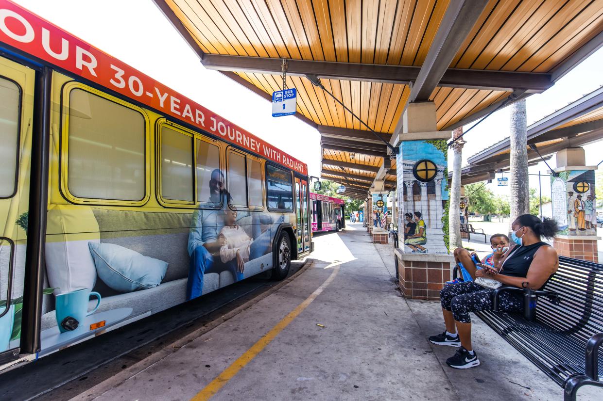 People wait for their bus at the Rosa Parks Downtown Station Wednesday afternoon, July 26, 2023. Gainesville Regional Transit System has announced that they are terminating a number of different bus routes. [Doug Engle/Ocala Star Banner]2023