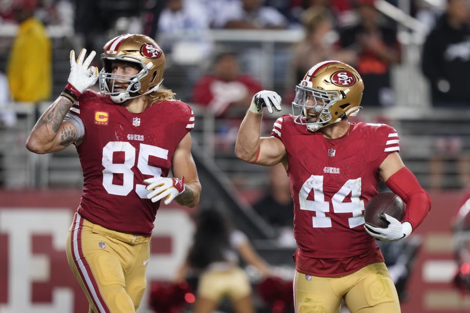 San Francisco 49ers tight end George Kittle (85) gestures with fullback Kyle Juszczyk (44) after scoring a touchdown against the Dallas Cowboys on Oct. 8 in Santa Clara, Calif.