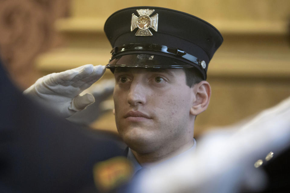 Photographs released by the Jersey City Mayor&rsquo;s Office show Sam Springsteen saluting during his swearing-in. (Photo: ASSOCIATED PRESS)