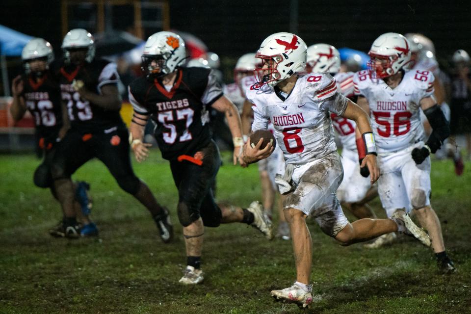 Hudson High junior quarterback Jake Attaway runs for some yardage during the game against Maynard at Alumni Field in Maynard, Sept. 29, 2023.