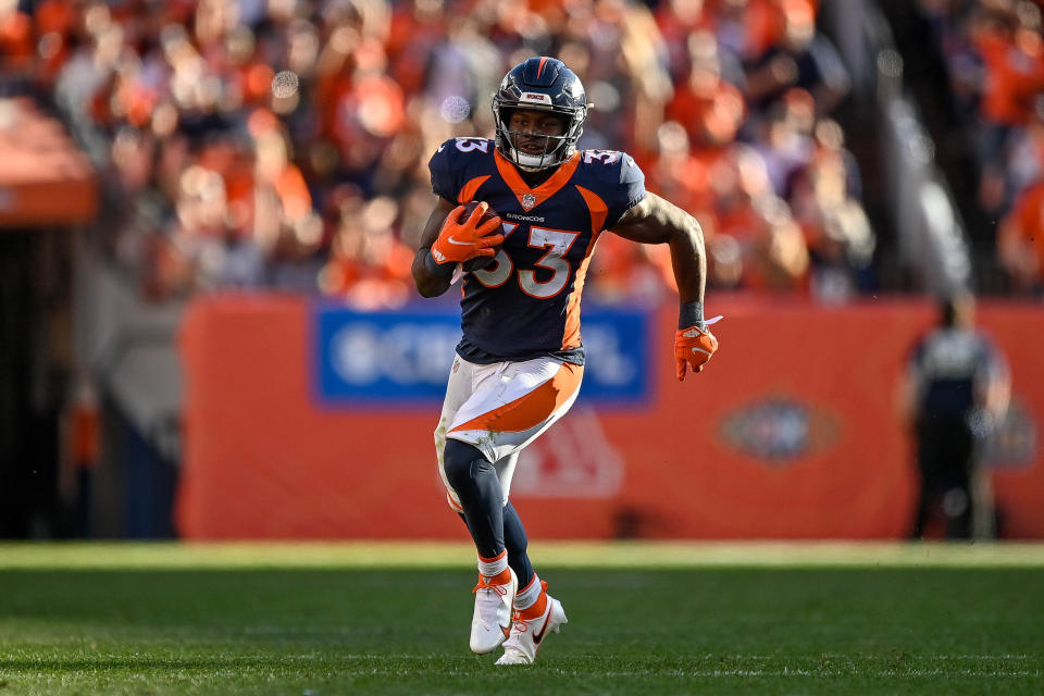 DENVER, CO - OCTOBER 17:  Javonte Williams #33 of the Denver Broncos rushes against the Las Vegas Raiders in the third quarter of a game at Empower Field at Mile High on October 17, 2021 in Denver, Colorado. (Photo by Dustin Bradford/Getty Images)