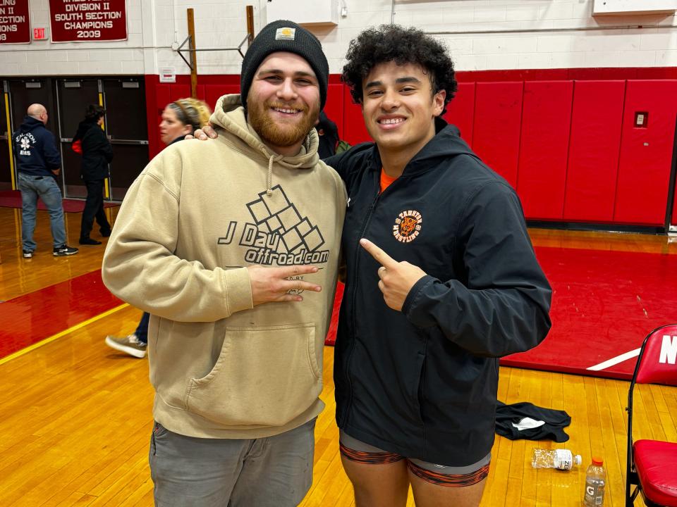 Former Taunton wrestler Christian Balmain (left) with current Taunton wrestler Ethan Harris (right) after Harris tied Balmain's record for the most wins in program history.