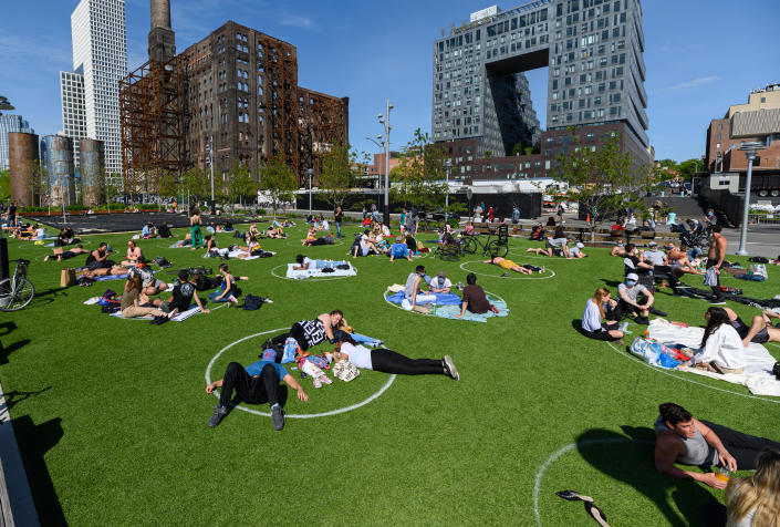 NEW YORK, NEW YORK - MAY 17: People practice social distancing in white circles in Domino Park in Williamsburg during the coronavirus pandemic on May 17, 2020 in New York City. COVID-19 has spread to most countries around the world, claiming over 316,000 lives with over 4.8 million infections reported. (Photo by Noam Galai/Getty Images)