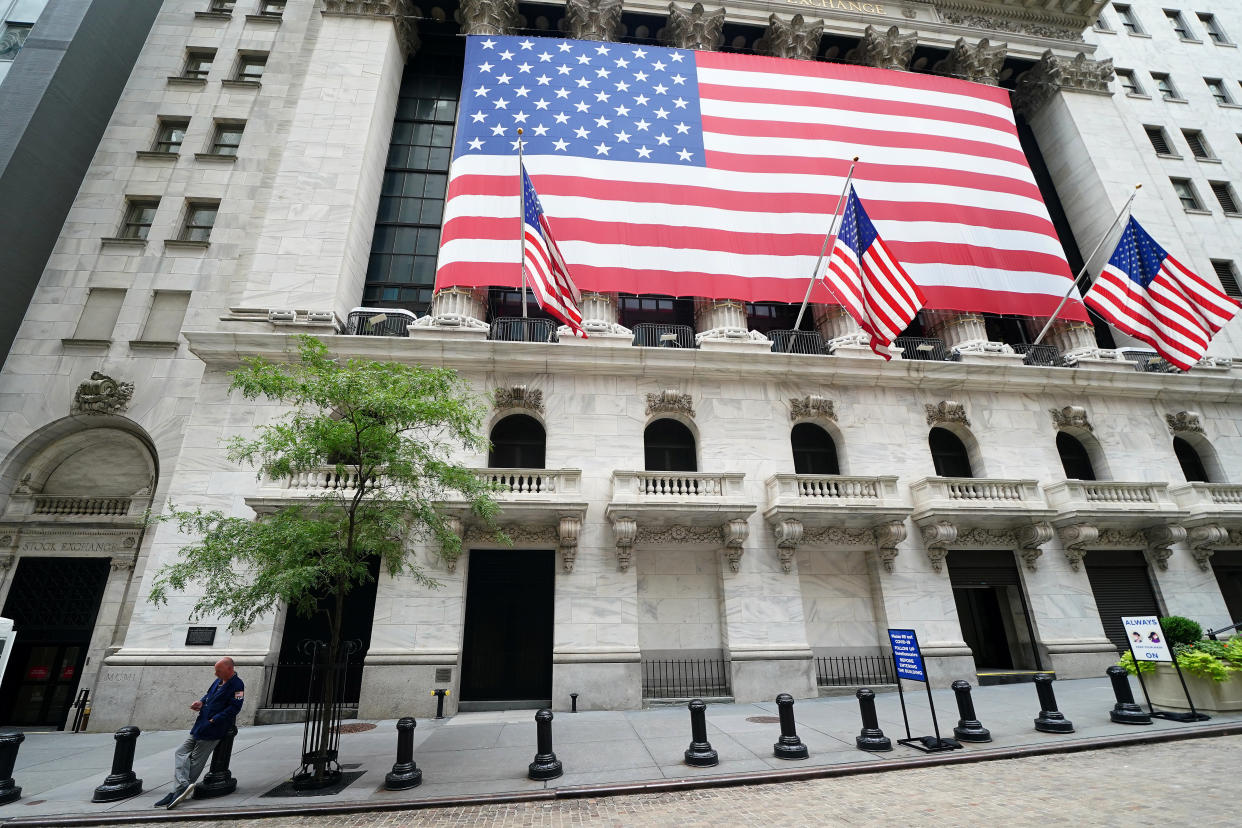 A trader stands outside the New York Stock Exchange in the financial district during the coronavirus disease (COVID-19) pandemic in the Manhattan borough of New York City, New York, U.S., September 9, 2020. Picture taken September 9, 2020.  REUTERS/Carlo Allegri