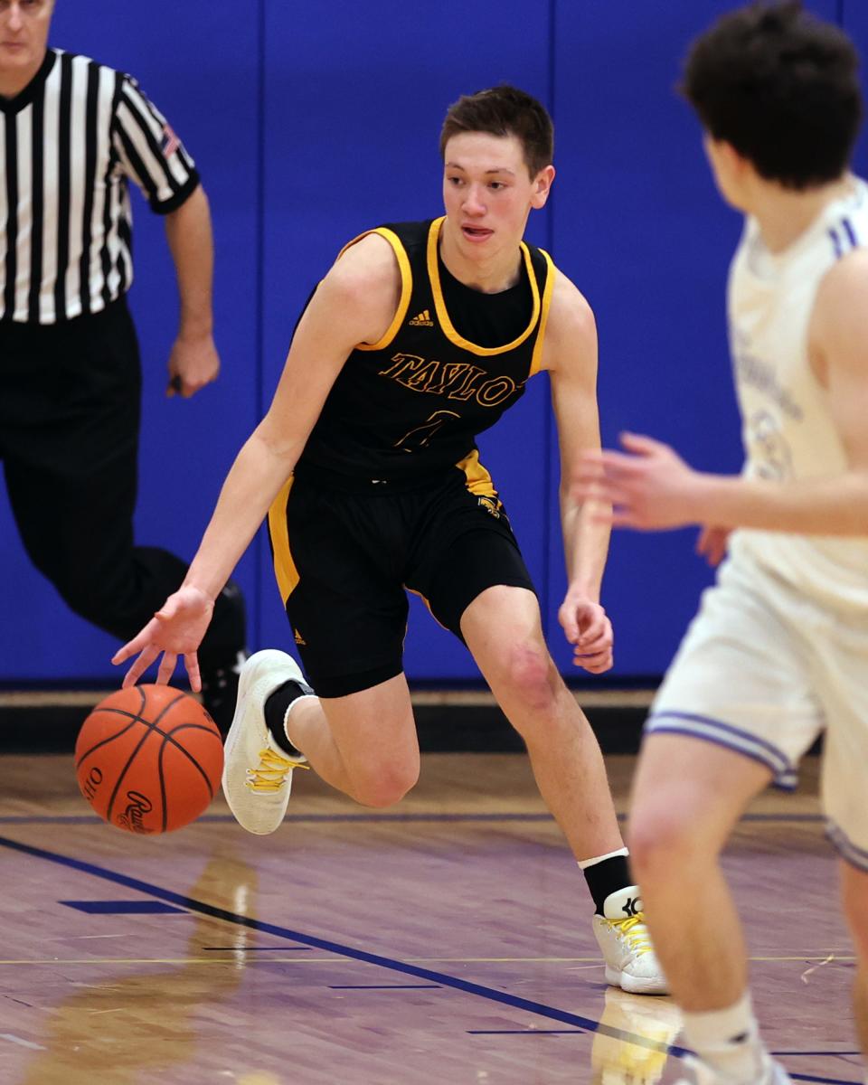 Taylor guard Danny Austing starts a fast break in the game between Taylor and Mariemont high school Jan. 14, 2022.