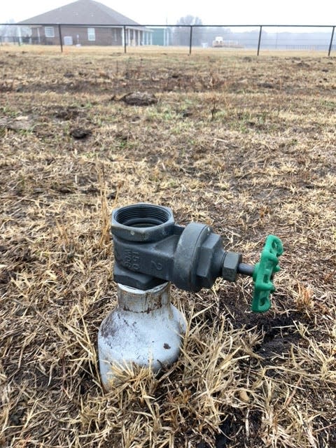 An orphan natural gas well stands on agricultural land in Oklahoma