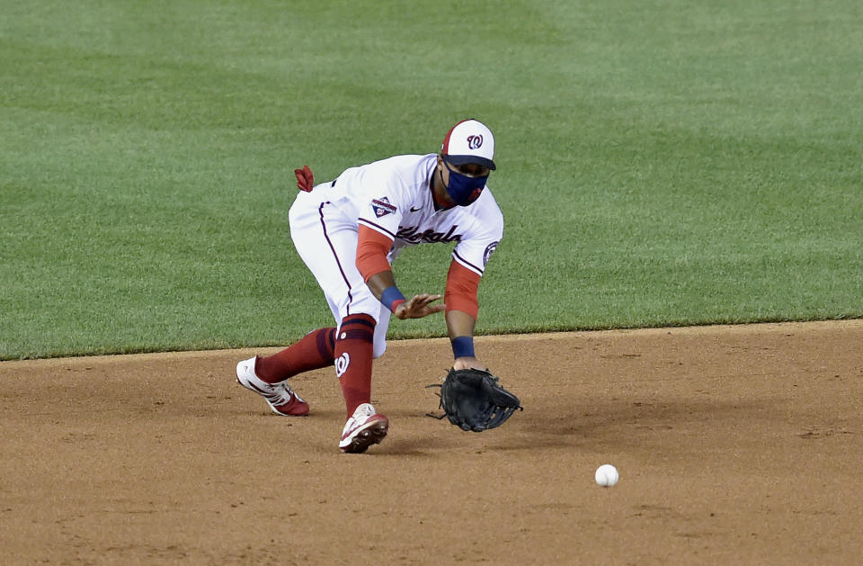 WASHINGTON, DC - JULY 21: Washington Nationals shortstop Wilmer Difo (1) fields a grounder while wearing a face mask or face covering because of the COVID-19 coronavirus pandemic during MLB Summer Camp scrimmage between the Baltimore Orioles and Washington Nationals at Nationals Park on July 21, 2020 in Washington, D.C.. (Photo by Randy Litzinger/Icon Sportswire via Getty Images)