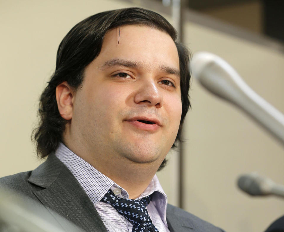 FILE - In this Feb. 28, 2014 file photo, Mt. Gox CEO Mark Karpeles speaks at a press conference at the Justice Ministry in Tokyo. The Tokyo bitcoin exchange that filed for bankruptcy protection blamed theft through hacking for its losses Monday, March 3, 2014, and said it was looking into a criminal complaint.(AP Photo/Kyodo News, File) JAPAN OUT, MANDATORY CREDIT