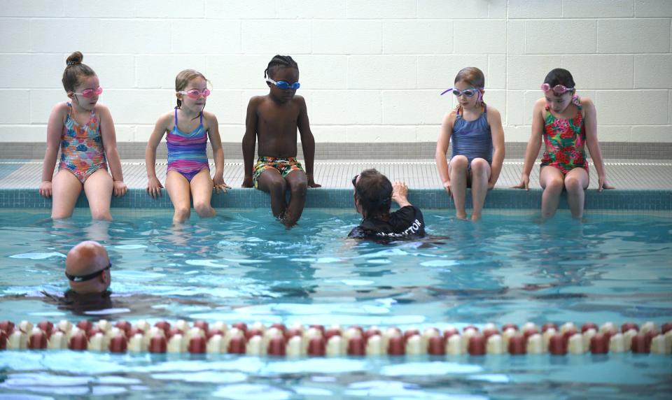 First grade students from Frazer Elementary School take swim lessons with instructor Jeff Miller at the Eric Snow Family YMCA in Canton as part of a partnership between the YMCA and Plain Local Schools.